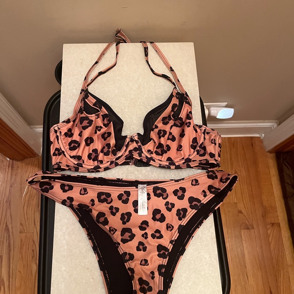 This is a Wolf & Whistle leopard-print bikini set in pink.